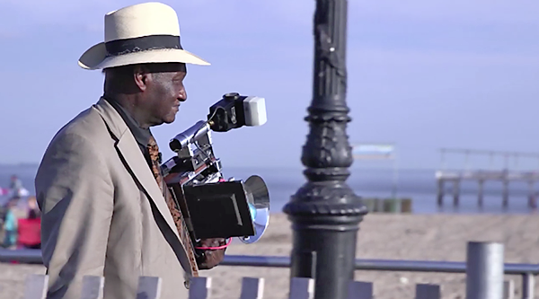 photo 1 - Louis Mendes and his jumbo Speed Graphic camera have been  fixtures on #NYC #streets for more than 60 years. Always looking dapper…