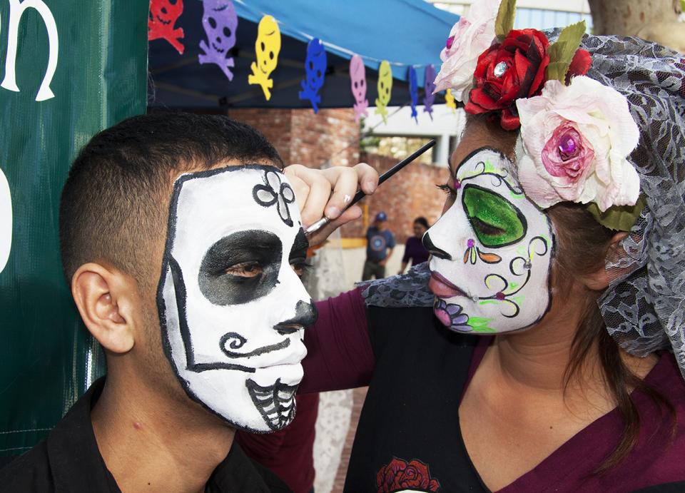 Face painting on Dia De Los Muertos (Day of the Dead) in Santa Ana